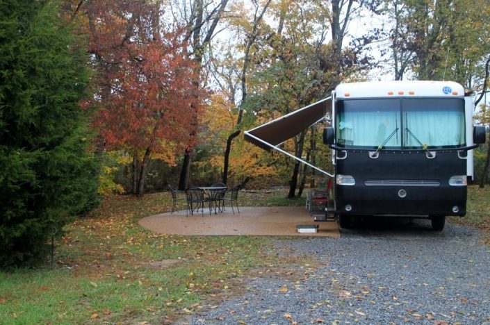 camper-beside-concrete-patio camper-beside-concrete-patio